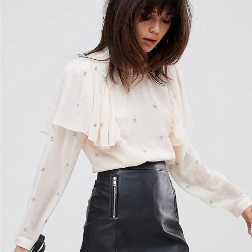 Religion High Neck Shirt with Ruffle and tie back.Silver shimmer details